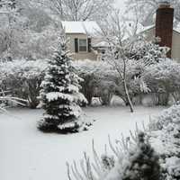 <p>Snow blanketed the landscape in Greenwich Friday morning, giving trees and lawns a wintery coat.</p>