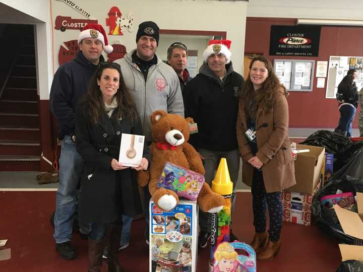 Katie Miller, left, and Janine Cook, right, collect toys for The Valley Hospital during last year&#x27;s Bergen County PBA Toy Drive.