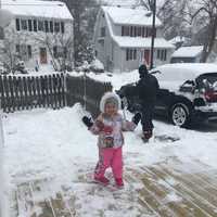 <p>Charlotte helps dad shovel.</p>