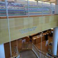 <p>Artist Katherine Daniels created an art installation of colorful plastic strips woven into the gridded surround of Greenwich Library&#x27;s grand stairs.</p>