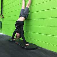 <p>Liam bangs out handstand push-ups in Great White.</p>