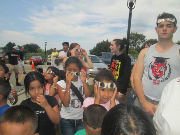 Kids gather at Ossining Library for the solar eclipse.