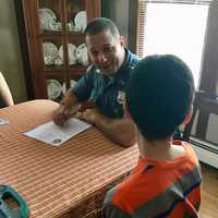 <p>Paramus Police Officer Lou Cardone enrolls a new member in the department&#x27;s Residents Identification Program.</p>