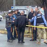 <p>Paramus Police Chief Robert Guidetti (in camo jacket, left) joined officers and detectives at the scene of the road rage stabbing on Route 4.</p>