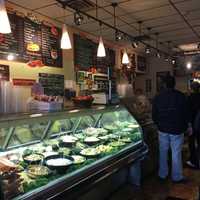 <p>Customers line up at Lenny&#x27;s Bagels.</p>