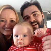 <p>Jared and Jessica Spingler with 1-year-old Liam.</p>