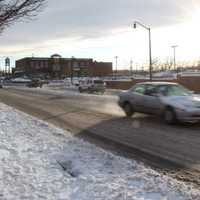 <p>Cars whip down plowed streets in Lodi.</p>