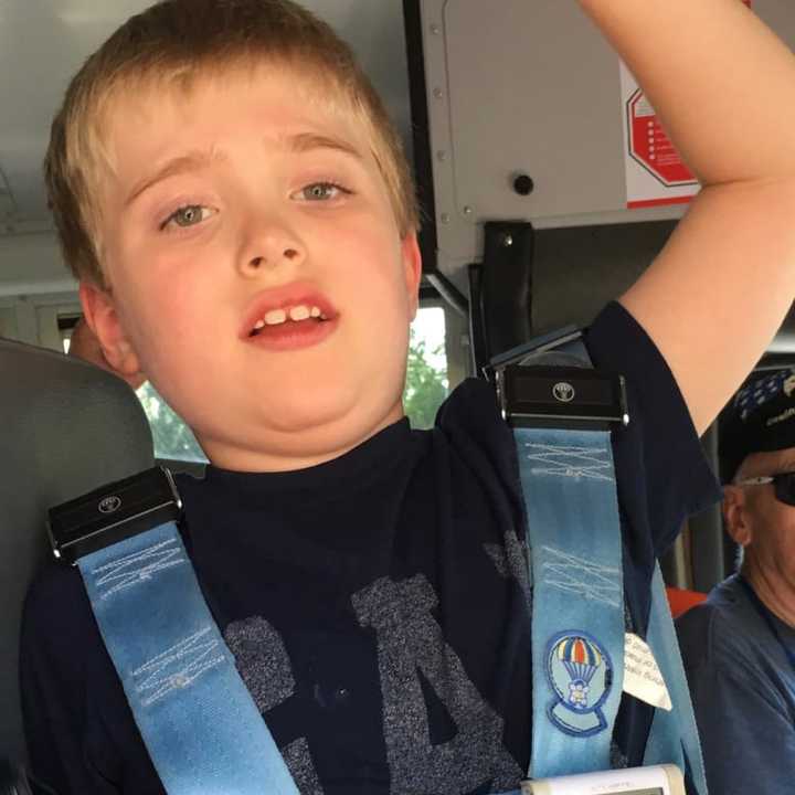 Mikey Schwing of Ridgewood arrives home from school on Wednesday. His thermometer reads the temperature on the bus provided by the district.