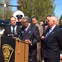 <p>State Sen. Ed Gomes of Bridgeport speaks out for a change in state open carry gun laws as Mayor Joe Ganim, left, and Police Chief AJ Perez, right, look on.</p>