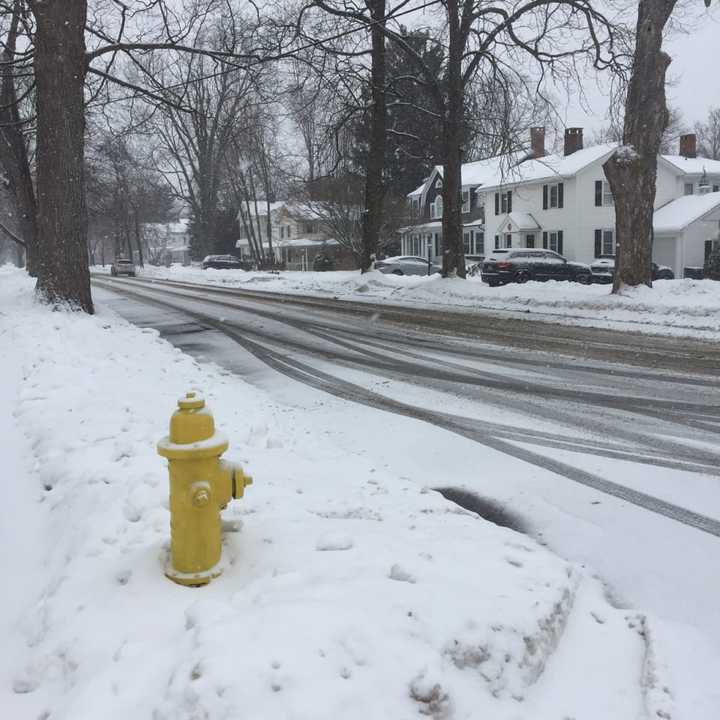 Snow is beginning to coat the roads again across Fairfield County, with another storm moving through on Sunday.