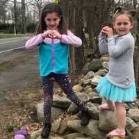 <p>Gianna (left) and Chelsea (right) Andriopoulus worked with their mother to create an art project that has turned into a warm-hearted message.</p>