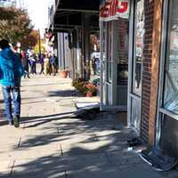 <p>The damage on West Palisade Avenue in Englewood included a broken store window.</p>