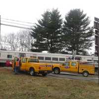 <p>Metropolitan Transportation Authority crews worked on a crossing gate on Friday, Jan. 27. A Metro-North spokesman said it may have been damaged by a motorist at the Commerce Street crossing in Valhalla.</p>