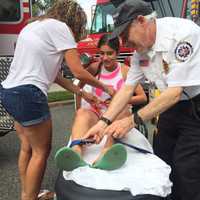 <p>Sandy Onorato and a Paramus EMT strap Chelsea, 17, onto a stretcher. Don&#x27;t worry, it was just for the photo-op.</p>