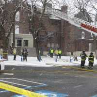 <p>White Plains firefighters battled a blaze near the top of a four-story apartment building along Mamaroneck Avenue on Tuesday afternoon.</p>