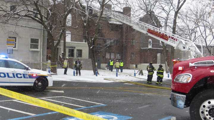 White Plains firefighters battled a blaze near the top of a four-story apartment building along Mamaroneck Avenue on Tuesday afternoon.