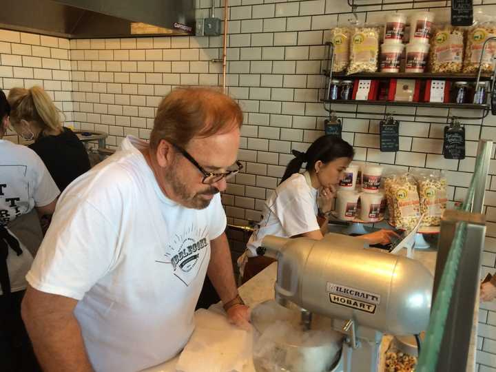 Owner David Mainiero watches the vapor from liquid nitrogen creating ice cream in seconds at Milkcraft of Fairfield.