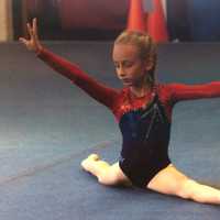 <p>Darien Level 3 gymnast Ava Telgheder hit a perfect split in her floor routine at the New England Invitational in Glastonbury.</p>