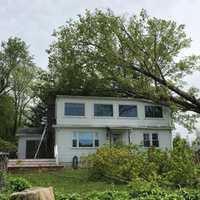 <p>A House on Lakeshore Drive in Carmel receives heavy damage from trees.</p>