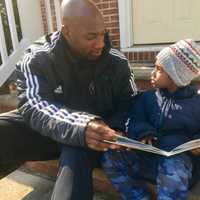 <p>Carlyle Myrie of Hackensack and his son, Ethan, 4. Myrie is a soccer coach in Clifton and began teaching spin at local gyms after he was let go from Teaneck schools.</p>