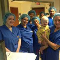 <p>Dr. Carol Shields and her team show baby Liam some love right before one of his exams.</p>