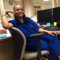 <p>Moore sits at the desk in the surgical unit at Holy Name — exactly where she was in August 2008 when she received a call that she had a match.</p>