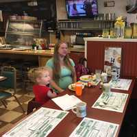 <p>Mary Shepheard and her daughter Autumn, 2, greet Sen. Chris Murphy over breakfast at Jacqueline&#x27;s restaurant in Bethel on Thursday.</p>