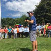 <p>U.S. Chris Murphy is surrounded by a circle of supporters as he arrives in Rogers Park in Danbury after walking across the entire state of Connecticut.</p>