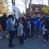 <p>Participants of all ages, some holding signs, took part in the event Sunday afternoon from Woods Bridge Road to Katonah Presbyterian Church.</p>