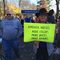 <p>&quot;America needs more colors, more choices, more brains&quot; says a marcher&#x27;s sign.</p>