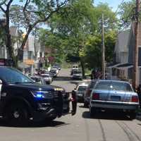 <p>Police close off Kossuth Street in Norwalk on Sunday to investigate a shooting.</p>