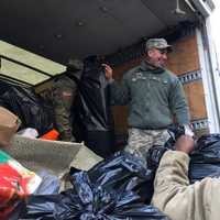 <p>Soldiers from the U.S. Army National Guard in Teaneck load truck.</p>