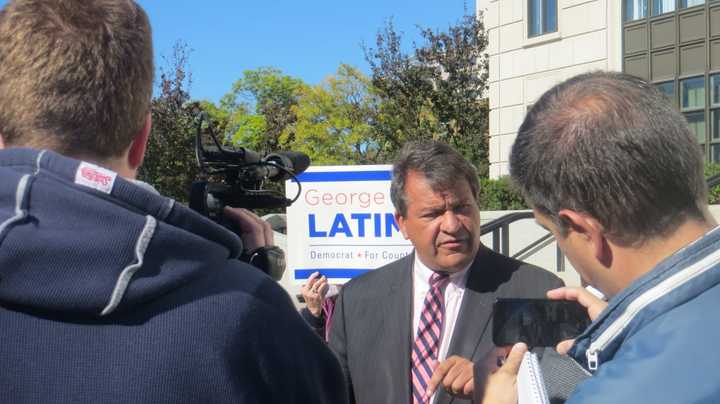 State Sen. George Latimer, center, a Democrat from Rye, answers reporters&#x27; questions about a corruption investigation that now involves gifts to Westchester County Executive Rob Astorino outside the U.S. Federal Court in White Plains on Friday.