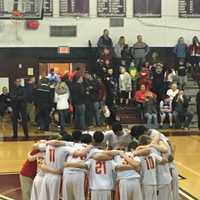 <p>Bergen Catholic&#x27;s freshmen basketball team huddles after a win.</p>