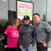 <p>Franchise Co-Owner Mario Salvo, center, stands with 16 Handles CEO Solomon Choi, right.</p>