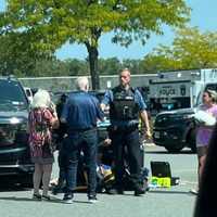 <p>A crowd had gathered around the woman shortly after the crash on Labor Day, Sept. 4.</p>