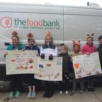 Holmes School Donates 100 Turkeys To Food Bank