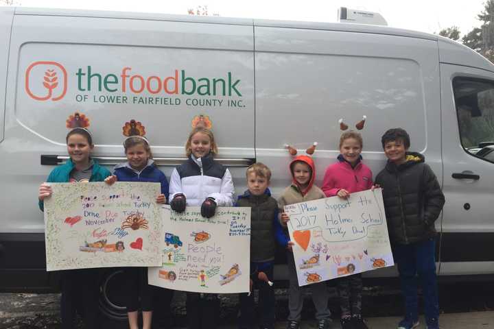 Holmes School Donates 100 Turkeys To Food Bank