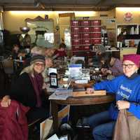 <p>Soli Pierce, far left, with fellow postcard writing attendees at The Black Cow Coffee Company in Croton.</p>