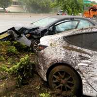 Driver, Passenger Hospitalized After Uber Barrels Into Parked Teslas Off Route 17