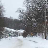 <p>The landscape is pretty bleak on Thursday, with gray skies, lots of flurries and the ground covered with snow.</p>