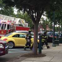 <p>Maywood firefighters clear the Oak Ale House Monday evening.</p>