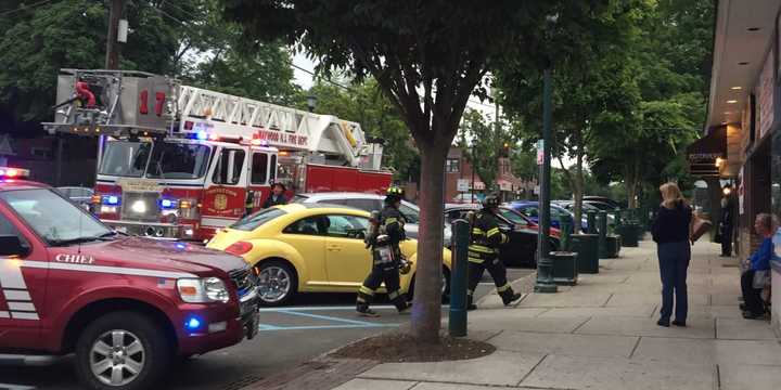 Maywood firefighters clear the Oak Ale House Monday evening.