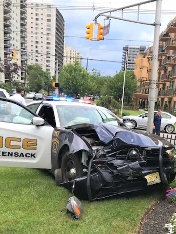 Police Officer, SUV Passengers Hospitalized After Crash