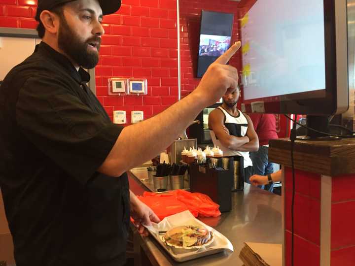 Juicy Platters owner Jaffar Wahdat &quot;digs deep&quot; Wednesday at work in Hackensack.