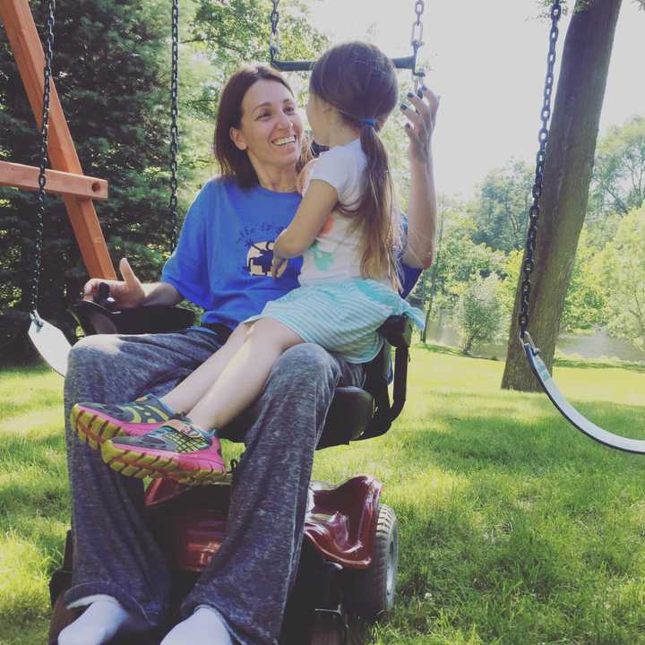 Donna Myhre with her daughter, Mikayla, in their Oakland backyard.
