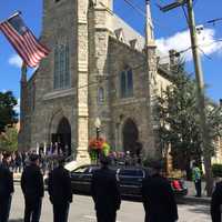 <p>Police officers line up on Main Street outside St. Peter&#x27;s Church for the funeral Mass for Danbury Police Sgt. Drew Carlson.</p>