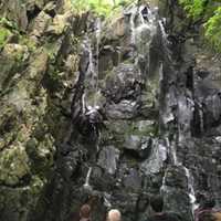 <p>Rappel team member works his way to the victim.</p>