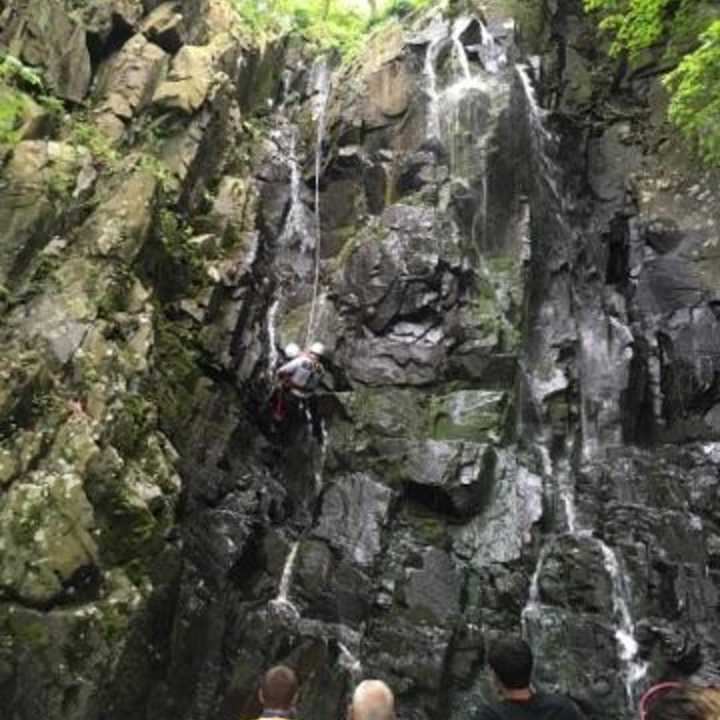 Rappel team member works his way to the victim.