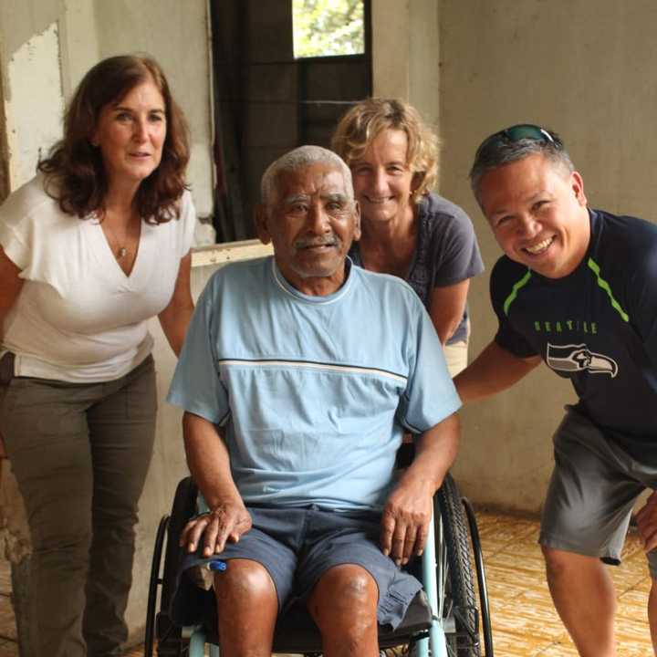 Kim Babcock, at left, after Jose Leon received his wheelchair.